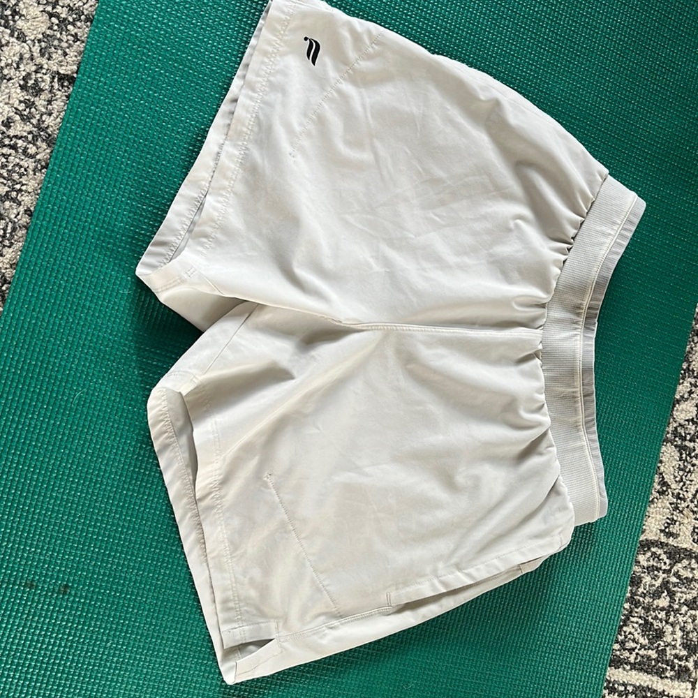 Men’s fabletics sport shorts. Grayish white color. Pockets and lining.